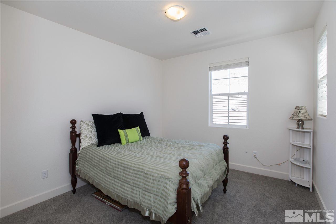 3115 Show Jumper Lane Reno, NV 89521 - Photo 19 of 25 a bed room with a bed and a window
