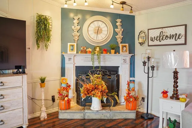 a view of living room with furniture and a fireplace
