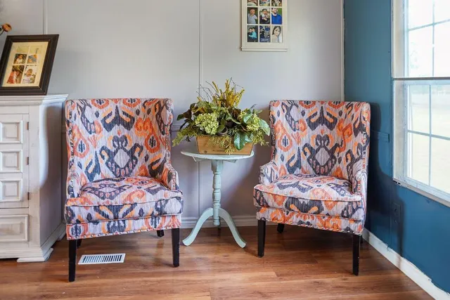 a living room with a couch and a potted plant