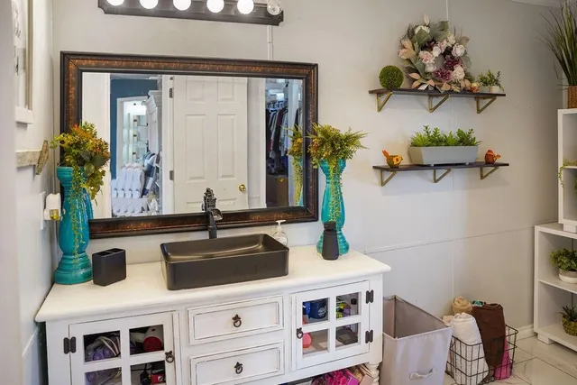 a bathroom with a sink and a mirror