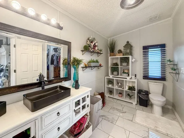 a kitchen that has a stove and a microwave