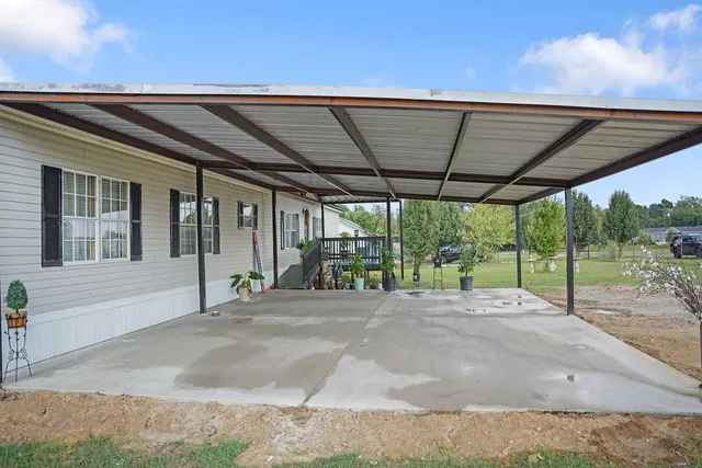 a view of a house with porch and sitting area