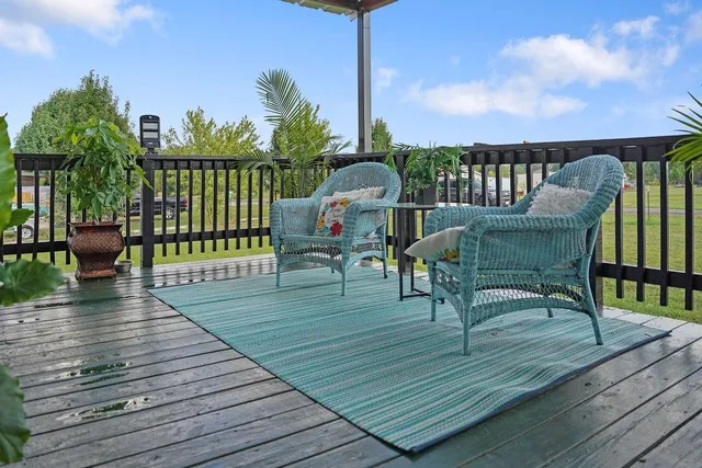 a view of a deck with furniture