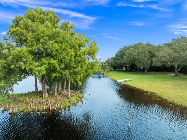a view of a swimming pool with an outdoor space and seating area