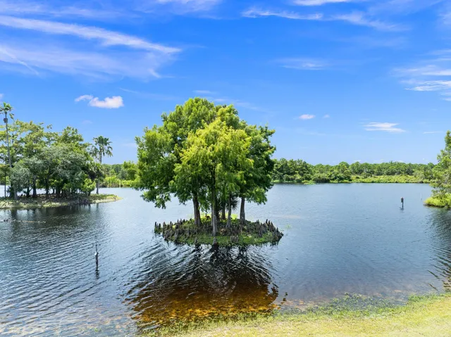 a view of a swimming pool with an outdoor space and seating area