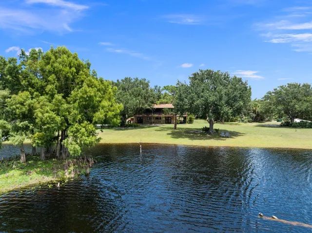 a view of a lake with a yard
