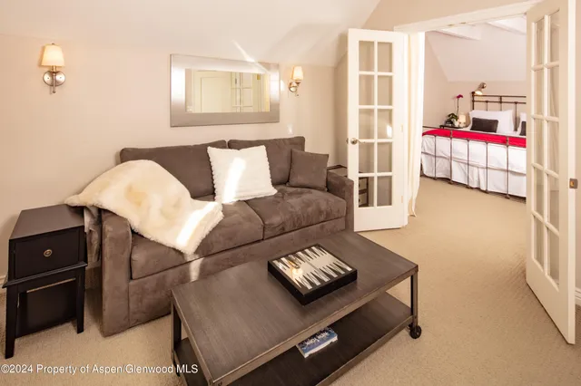 a kitchen with stainless steel appliances kitchen island granite countertop a table and chairs