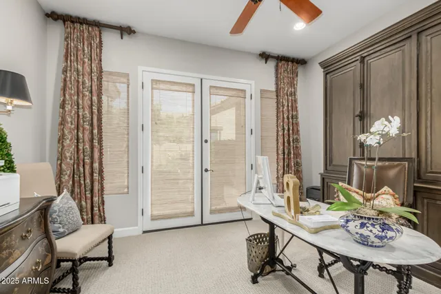 a view of a livingroom with furniture and a window