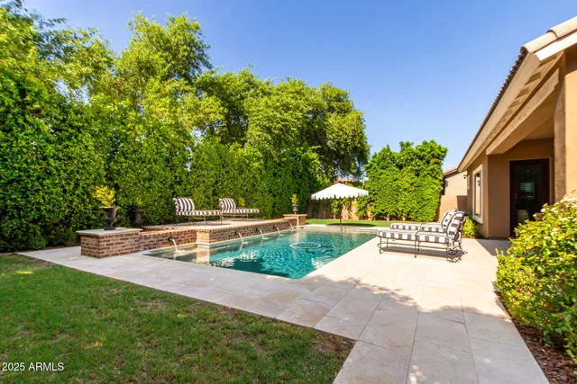 a view of house with outdoor space and sitting area