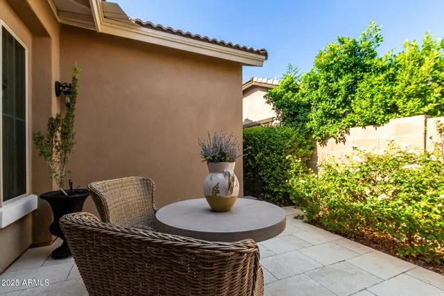a table and chairs in front of a door