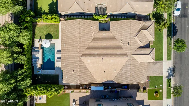 an aerial view of a house with a yard