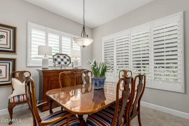 a dining room with furniture and window