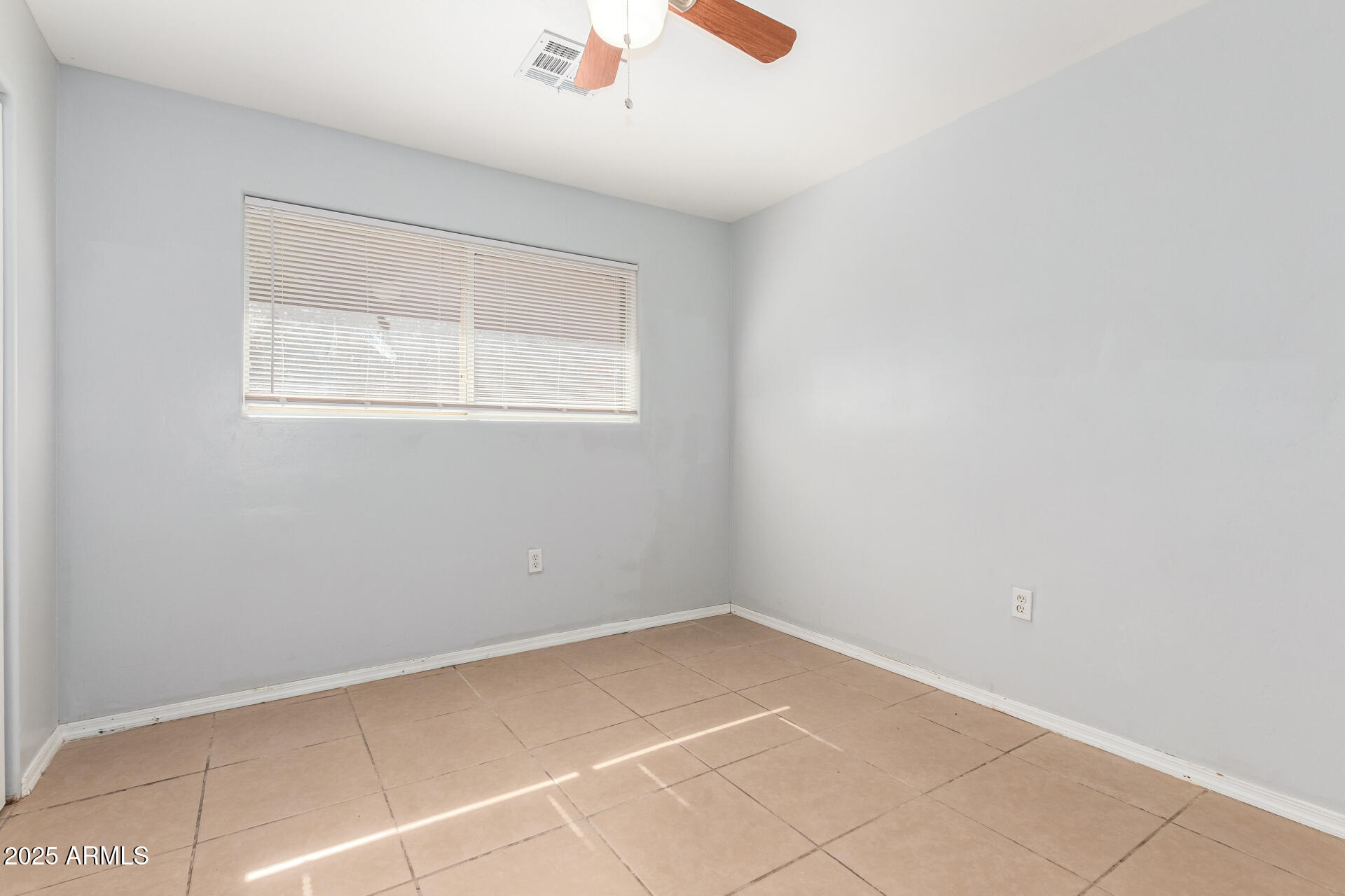 105 West 8th Street Eloy, AZ 85131 - Photo 19 of 31 a view of an empty room with a window