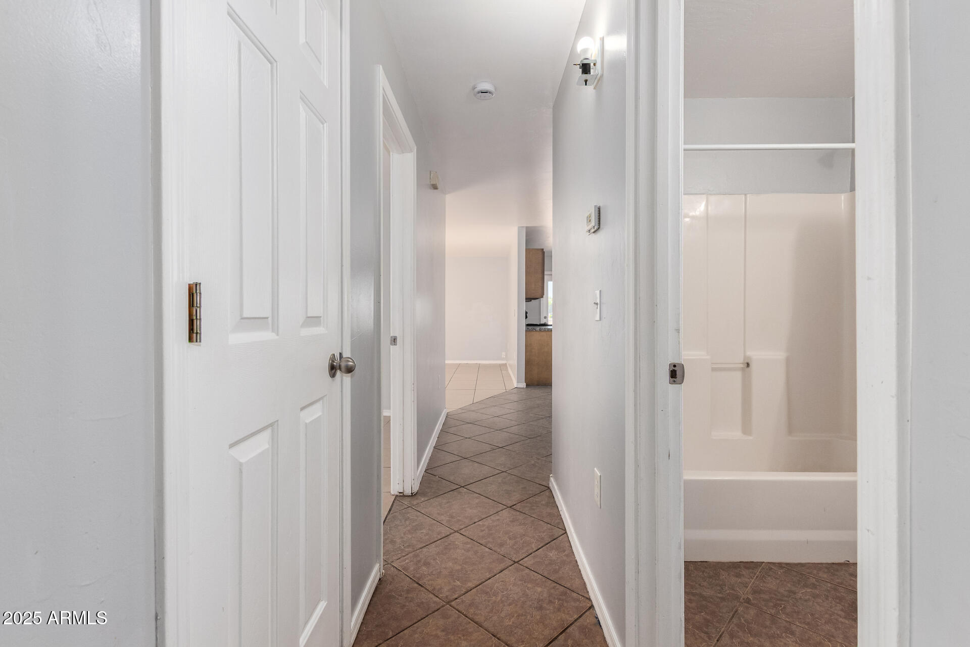 105 West 8th Street Eloy, AZ 85131 - Photo 21 of 31 a view of a hallway with wooden floor and closet area