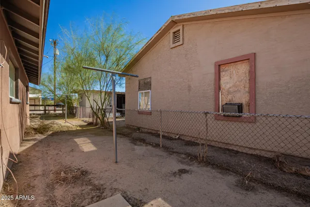 a view of a backyard of the house