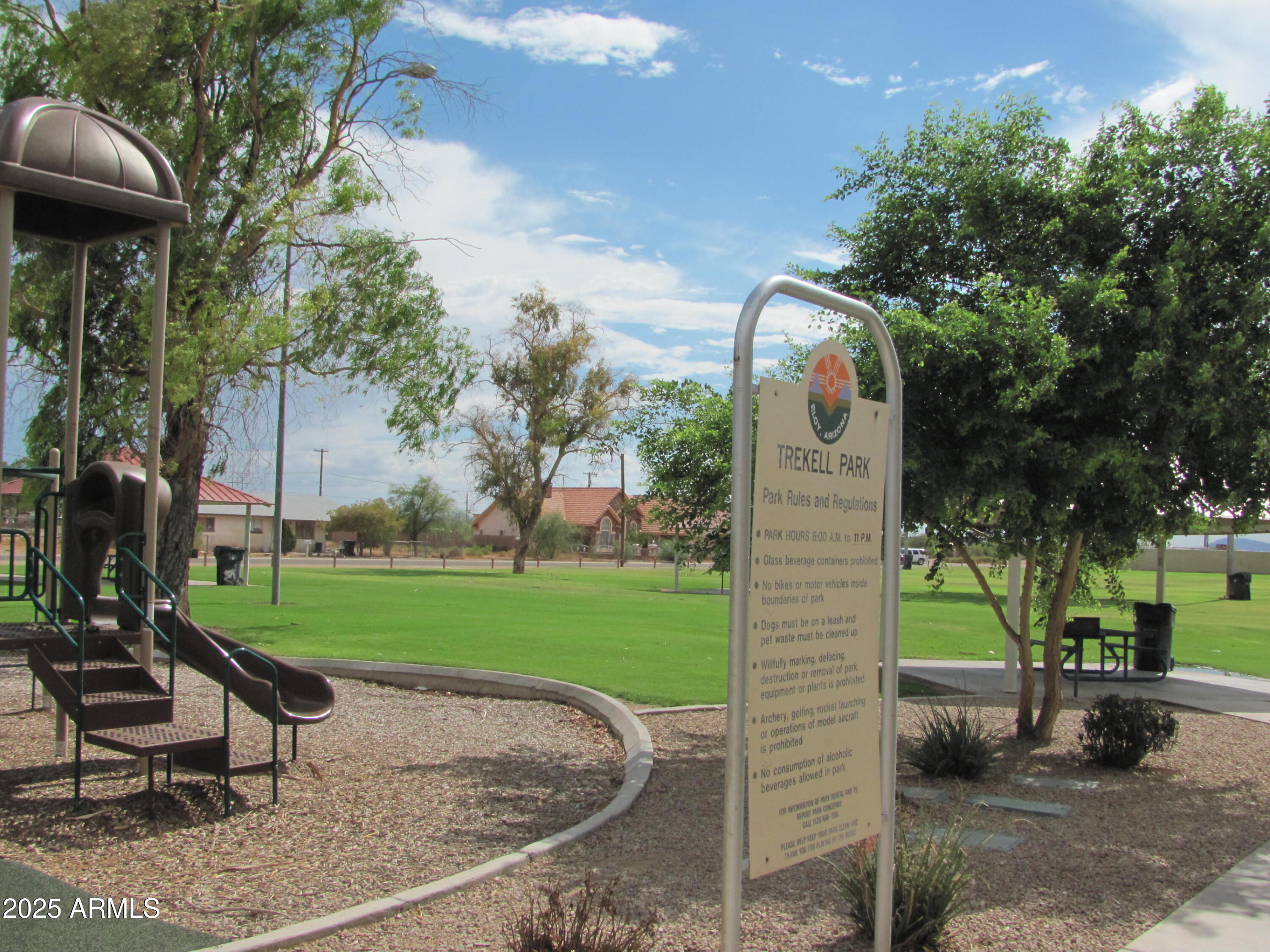 105 West 8th Street Eloy, AZ 85131 - Photo 31 of 31 a view of a park with plants and a slide