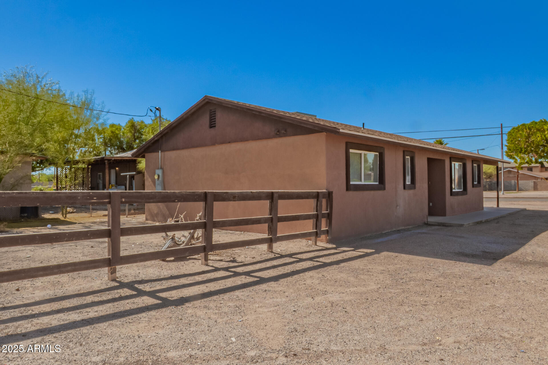 105 West 8th Street Eloy, AZ 85131 - Photo 6 of 31 a front view of a house with wooden fence