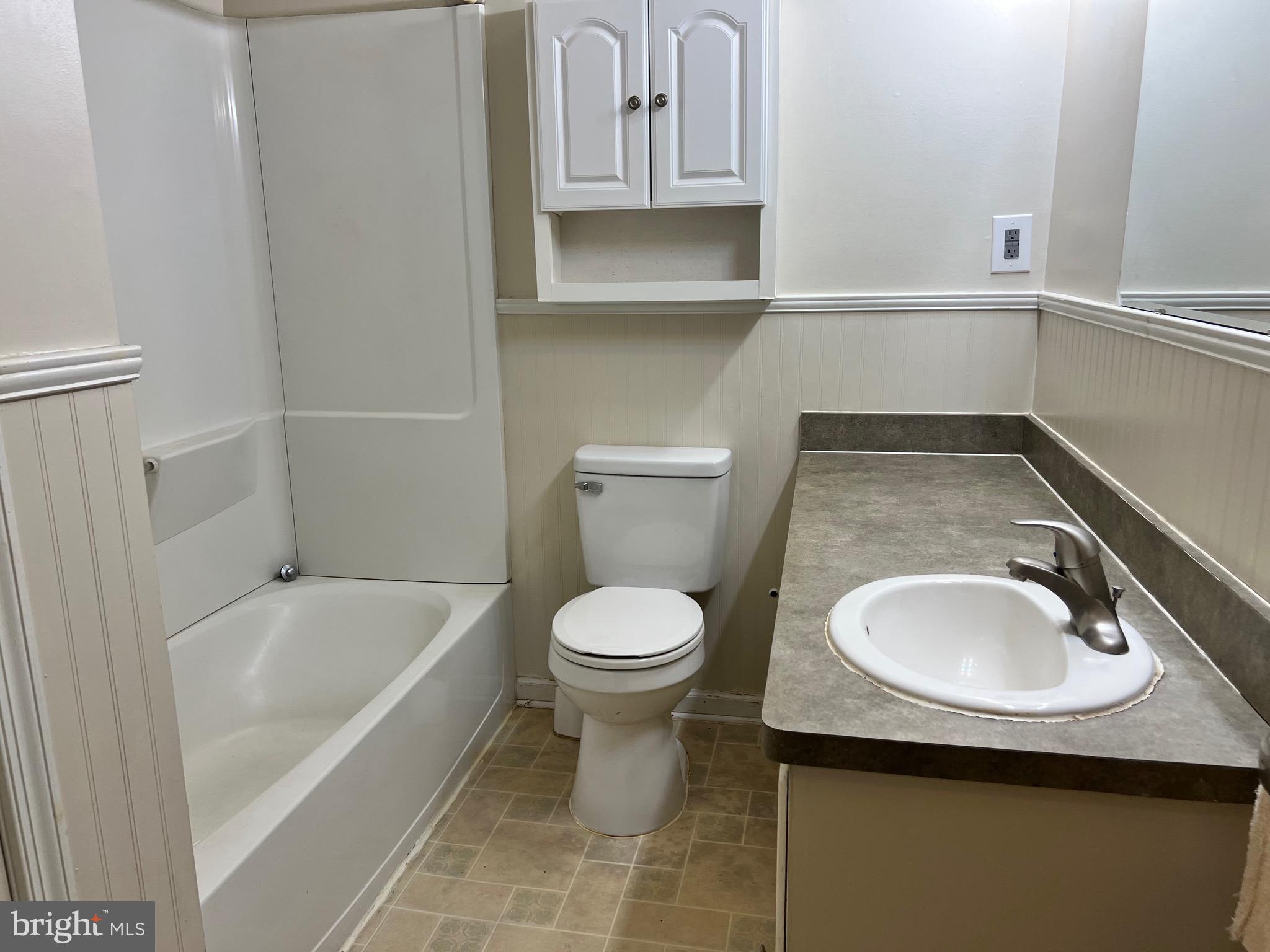 5700 Harrison Road Fredericksburg, VA 22407 - Photo 17 of 29 a bathroom with a sink a toilet and bathtub