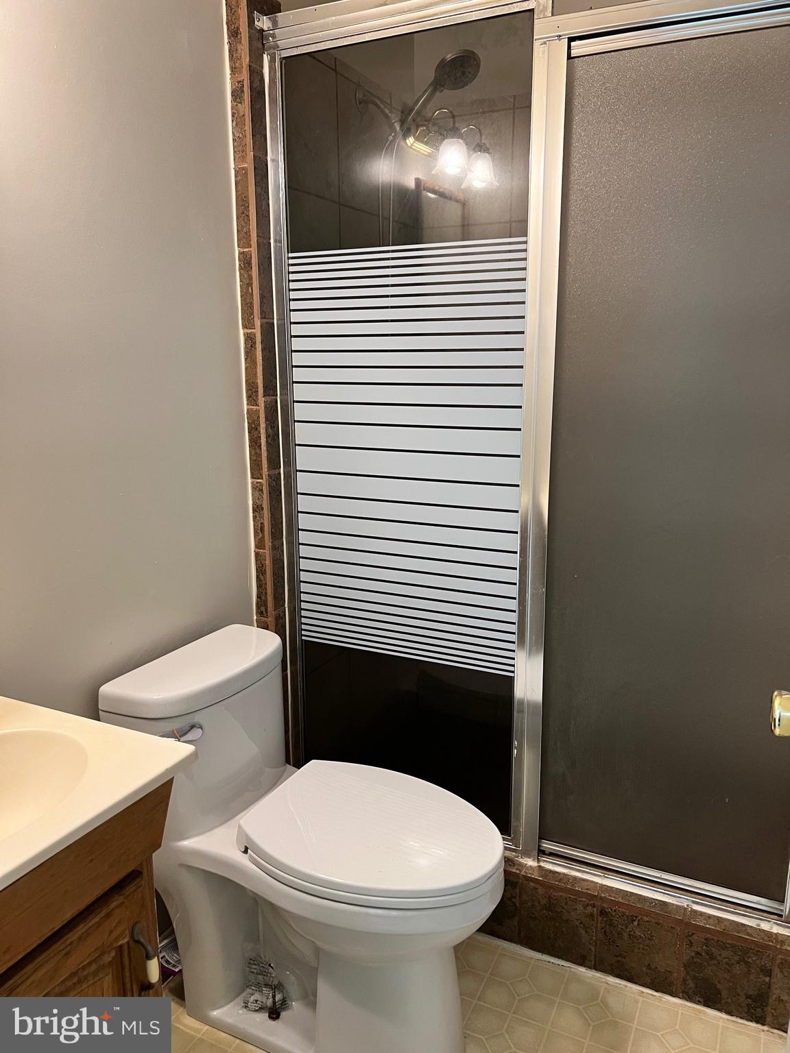 5700 Harrison Road Fredericksburg, VA 22407 - Photo 19 of 29 a bathroom with a toilet and a shower