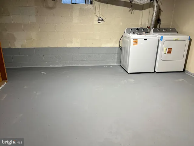 a bathroom with a sink toilet and a mirror