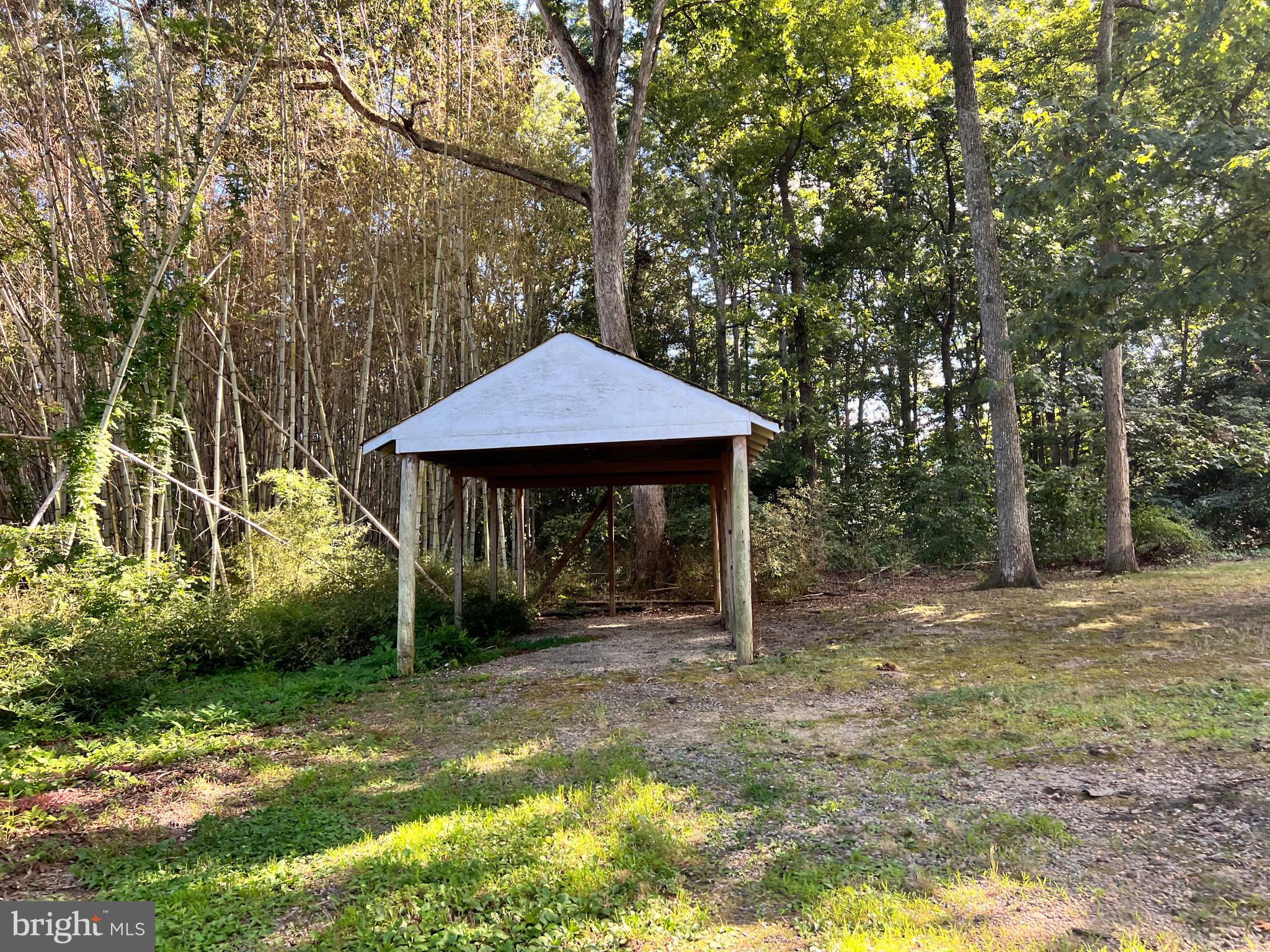 5700 Harrison Road Fredericksburg, VA 22407 - Photo 3 of 29 a backyard of a house with table and chairs
