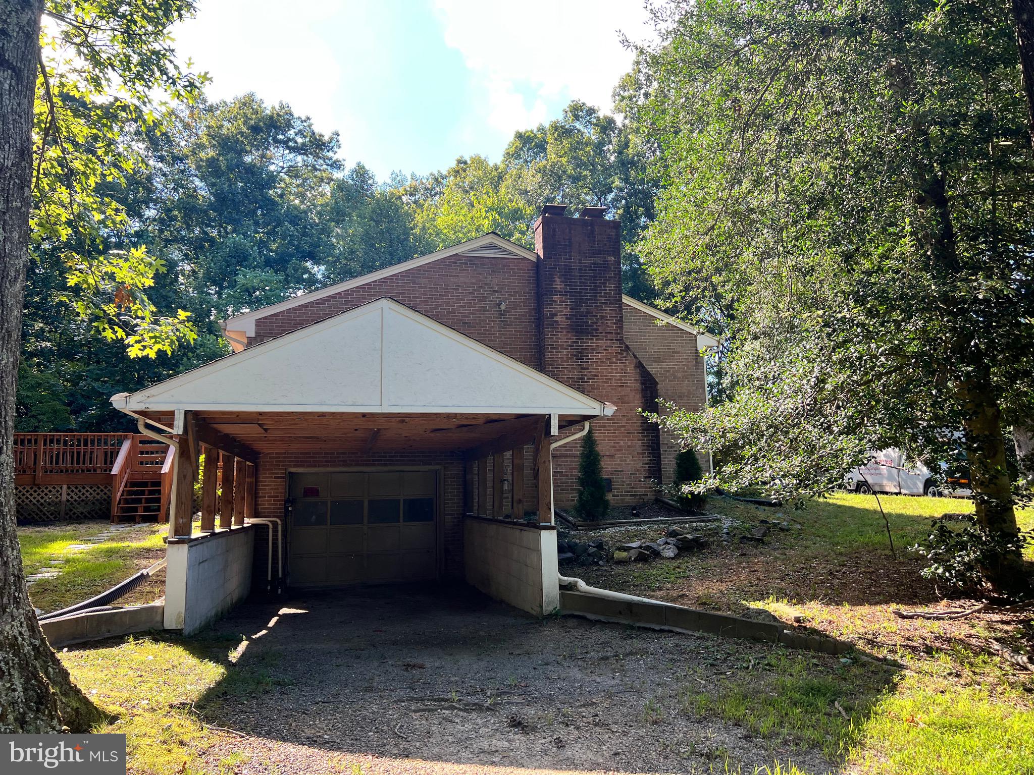5700 Harrison Road Fredericksburg, VA 22407 - Photo 5 of 29 a view of a house with backyard and trees