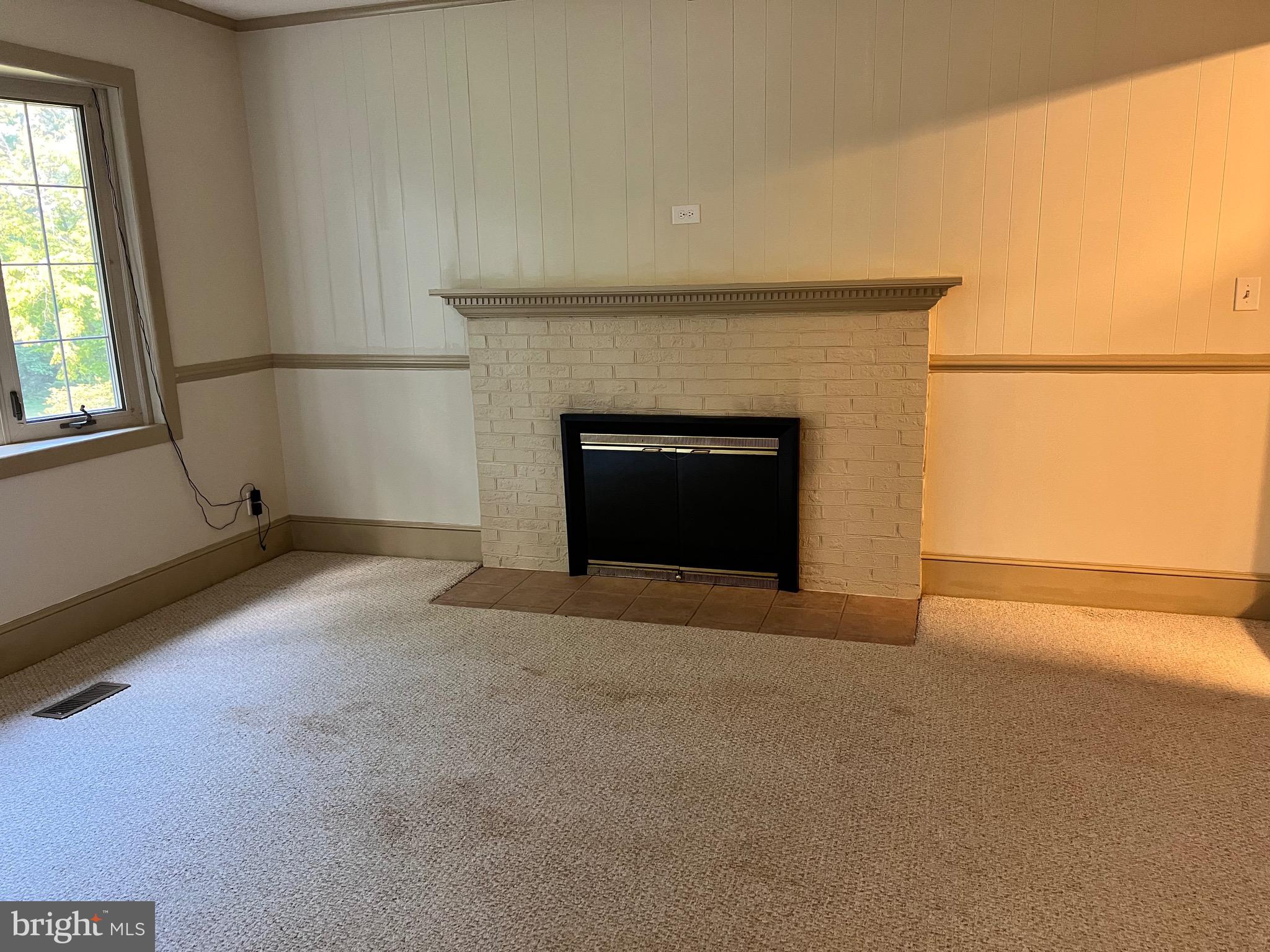 5700 Harrison Road Fredericksburg, VA 22407 - Photo 10 of 29 a view of empty room with a fireplace