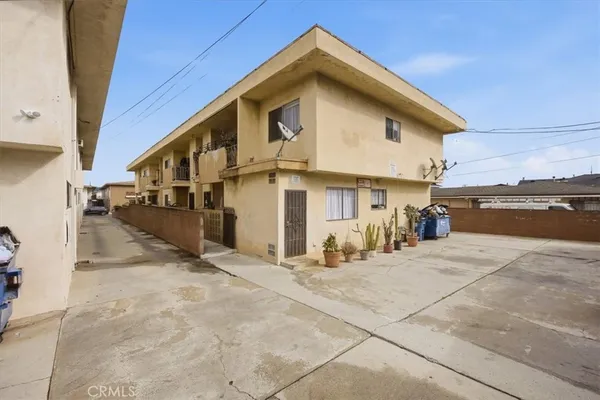a bedroom with furniture and a book shelf
