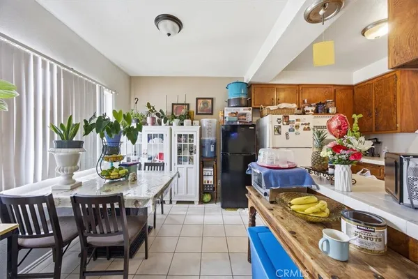 a kitchen with a sink stove and wooden cabinets