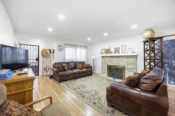 a living room with furniture and a fireplace