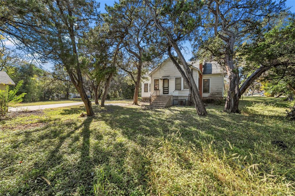 2623 North 15th A Street Waco, TX 76708 - Photo 21 of 23 a front view of a house with a yard