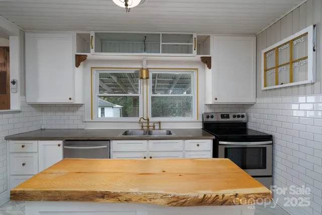 a kitchen with a table and chairs
