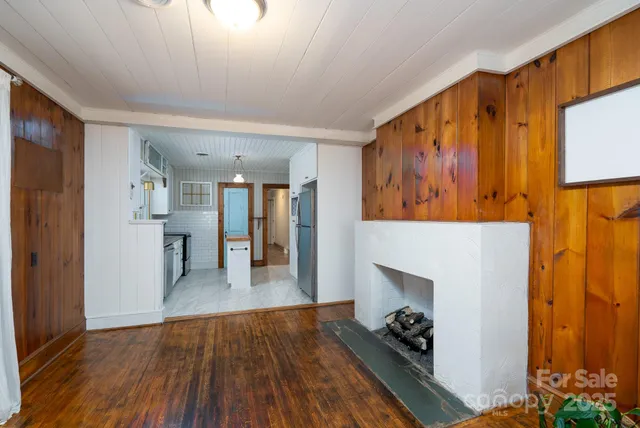 a view of a hallway view with wooden floor and staircase