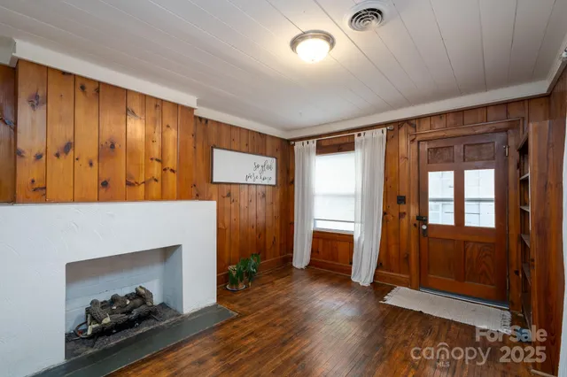 a view of an entryway with wooden floor