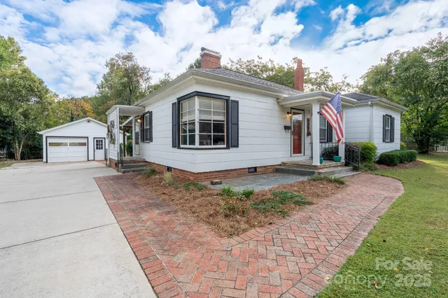 a view of house with a yard