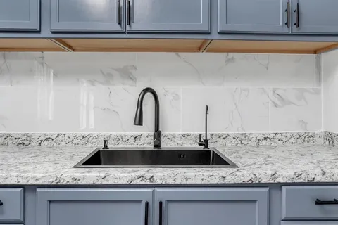 a view with a sink and dishwasher