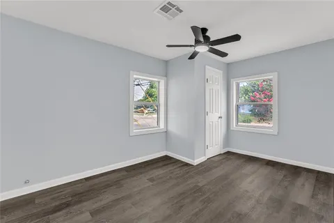 a view of workspace with wooden floor ceiling fan