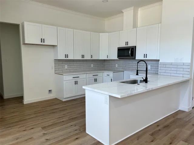 a bathroom with a bathtub and window