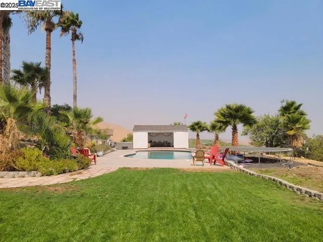 a view of a play ground in front of a house