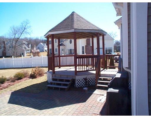 77 Hardwick Road Ashland, MA 01721 - Photo 13 of 25 a view of a deck with a table and chairs
