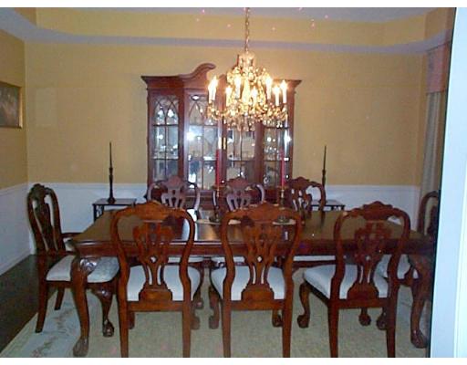 77 Hardwick Road Ashland, MA 01721 - Photo 14 of 25 a view of a dining room with furniture and chandelier