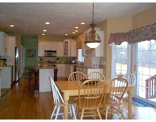 77 Hardwick Road Ashland, MA 01721 - Photo 4 of 25 a dining room filled with furniture and a chandelier