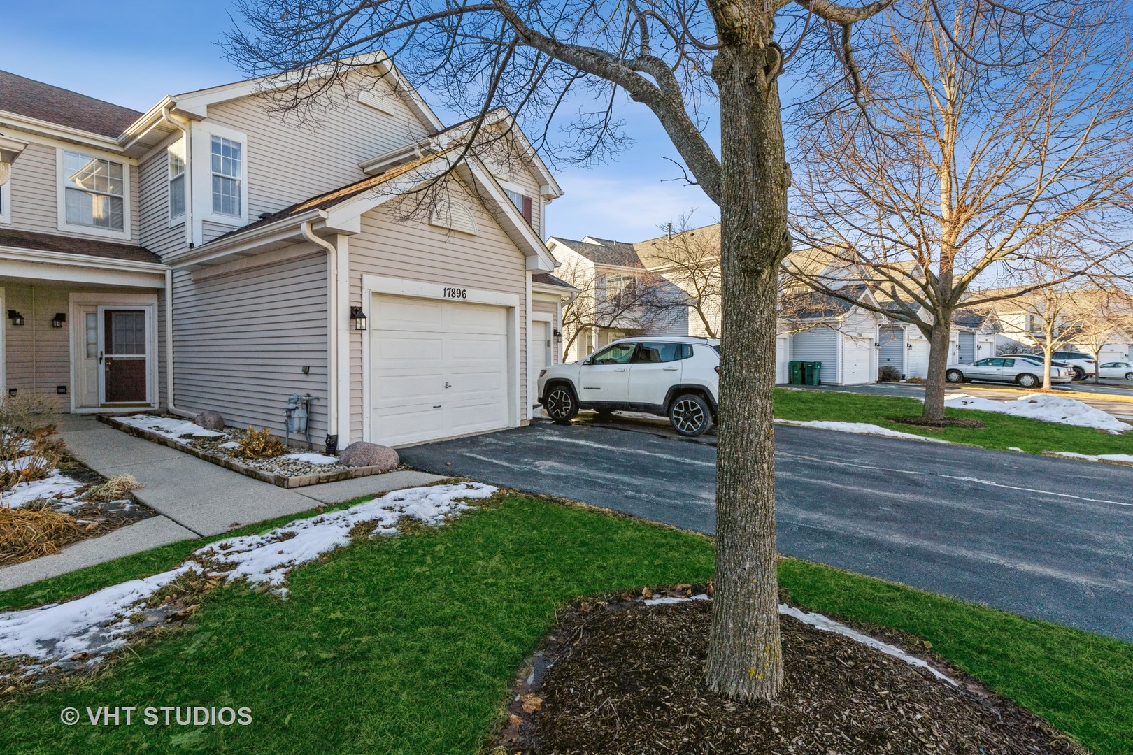 17896 Braewick Road Gurnee, IL 60031 - Photo 1 of 18 a view of a white house and a large tree