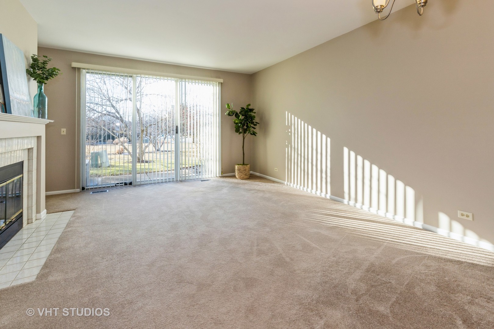 17896 Braewick Road Gurnee, IL 60031 - Photo 2 of 18 a view of an empty room with a fireplace