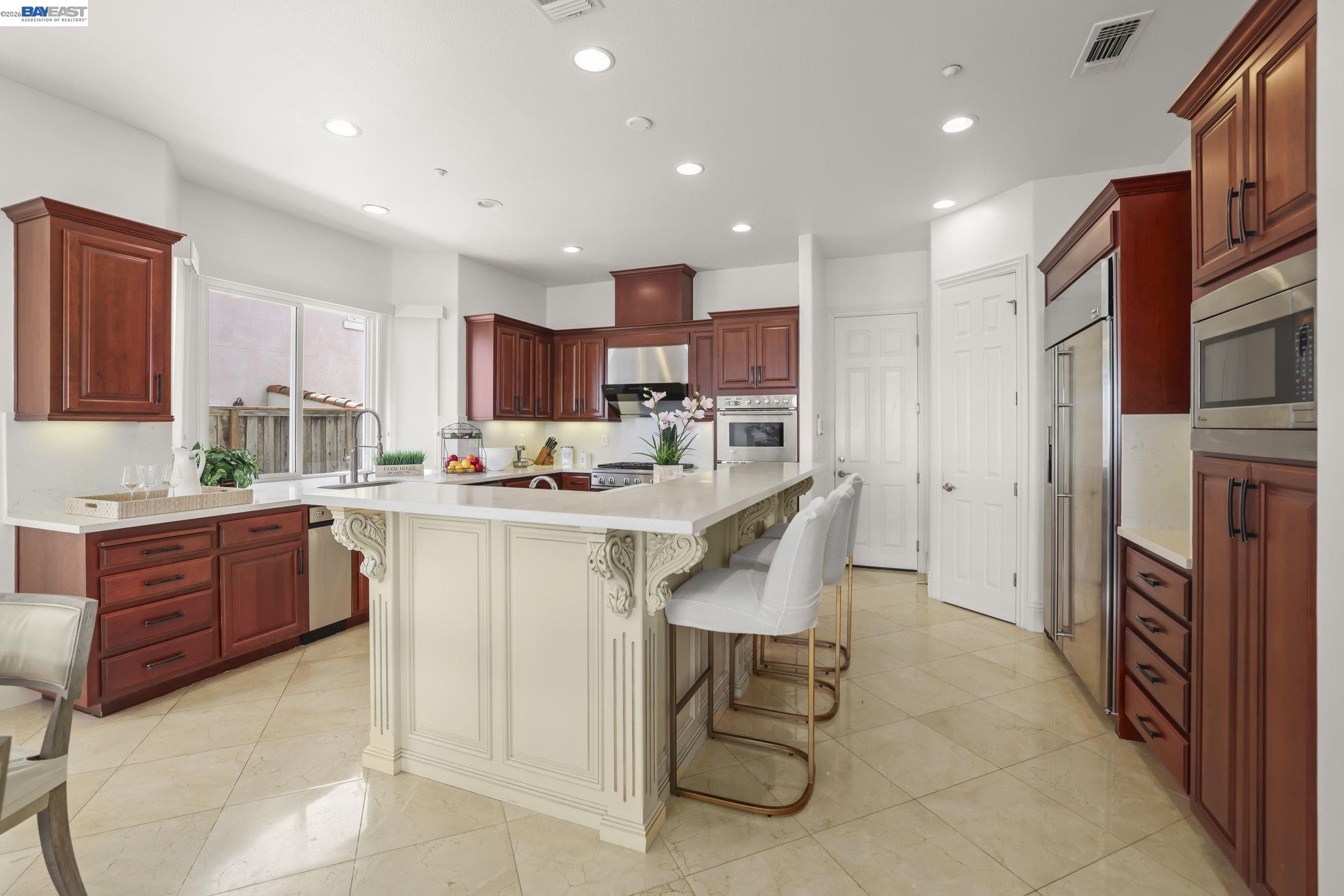 950 Winsford Court San Ramon, CA 94583 - Photo 28 of 68 a kitchen with granite countertop a counter top space appliances and cabinets