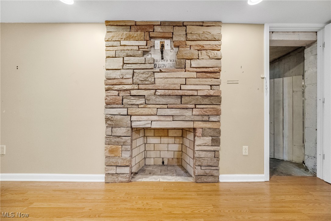 4430 Silsby Road Cleveland, OH 44118 - Photo 34 of 43 Interior details featuring a stone fireplace and hardwood / wood-style floors