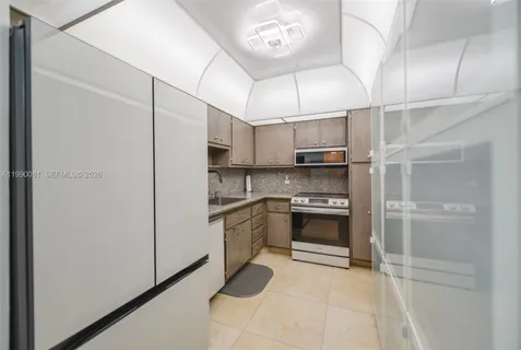 a kitchen with stainless steel appliances a stove and a refrigerator