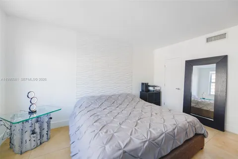 a view of walk in closet with clothes