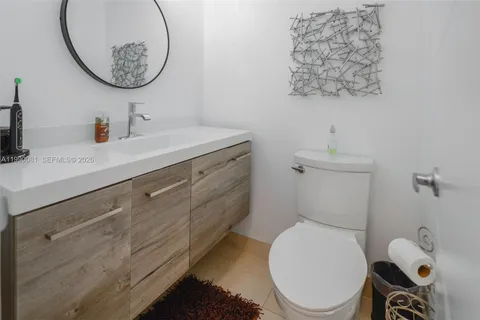 a kitchen with stainless steel appliances a refrigerator a stove a microwave and cabinets