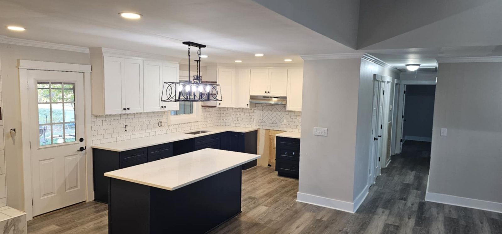 a kitchen with counter top space and sink